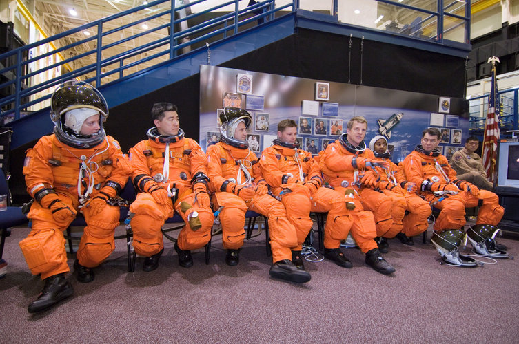 The STS-120 crewmembers await the start of a training session in the Space Vehicle Mockup Facility at Johnson Space Center