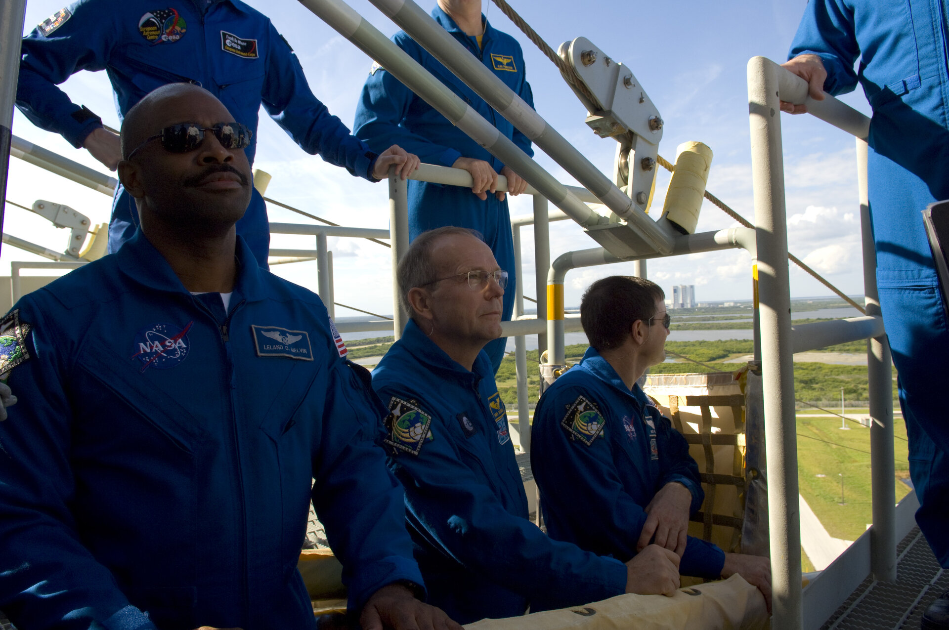 Hans Schlegel and his fellow STS-122 crew members, climb into the slidewire basket