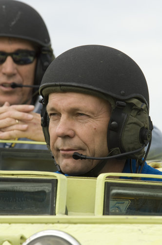 Hans Schlegel practices driving an emergency evacuation vehicle during training at Kennedy Space Center, Florida