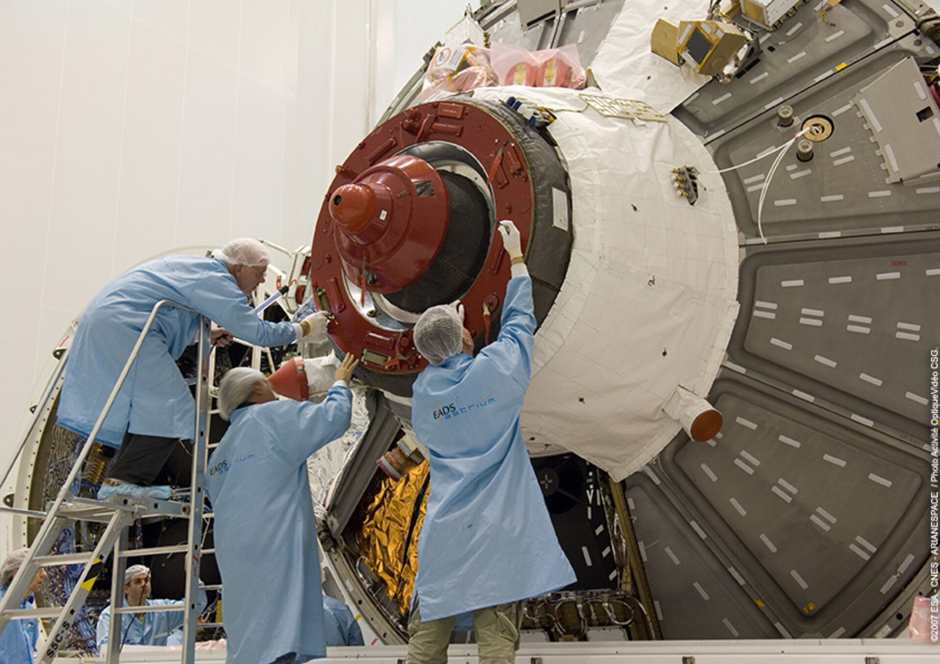 Engineers work on Jules Verne ATV's docking mechanism