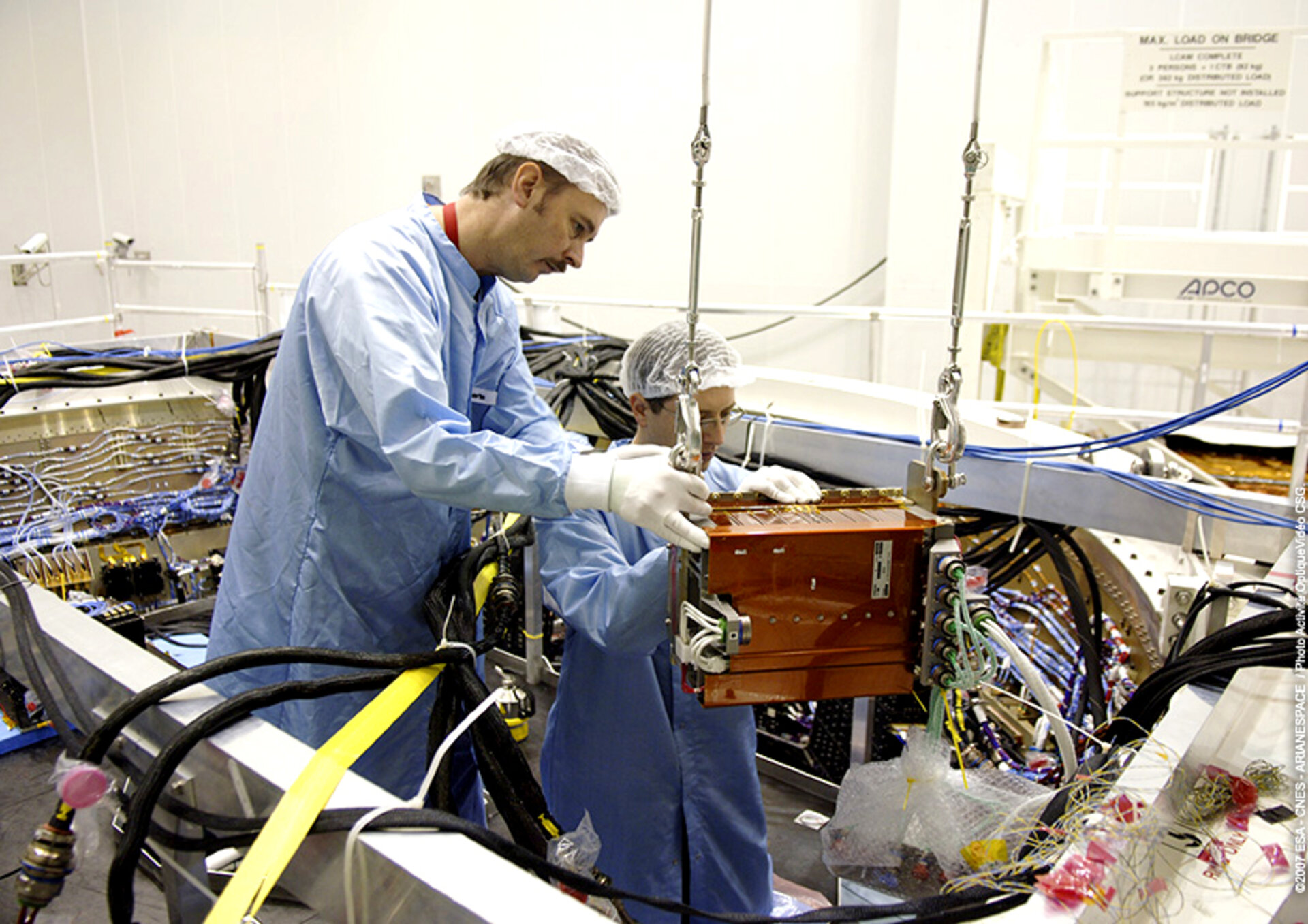 Preparing batteries for placement inside Jules Verne ATV's Equipped Avionics Bay