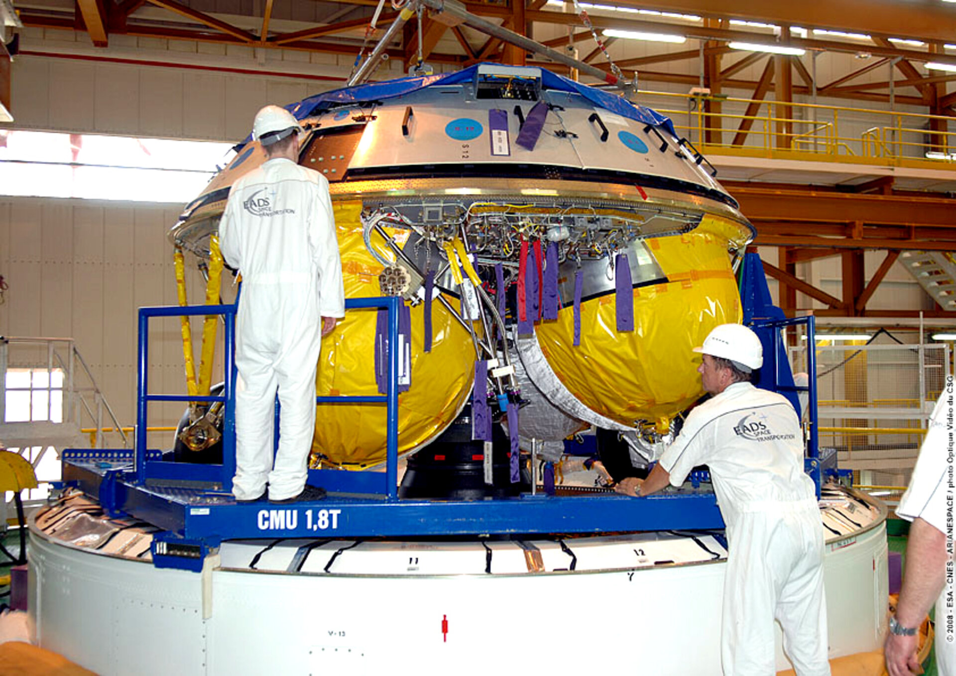 Engineers at Europe's Spaceport in Kourou, French Guiana, prepare the Ariane 5 ES ATV for the Jules Verne flight