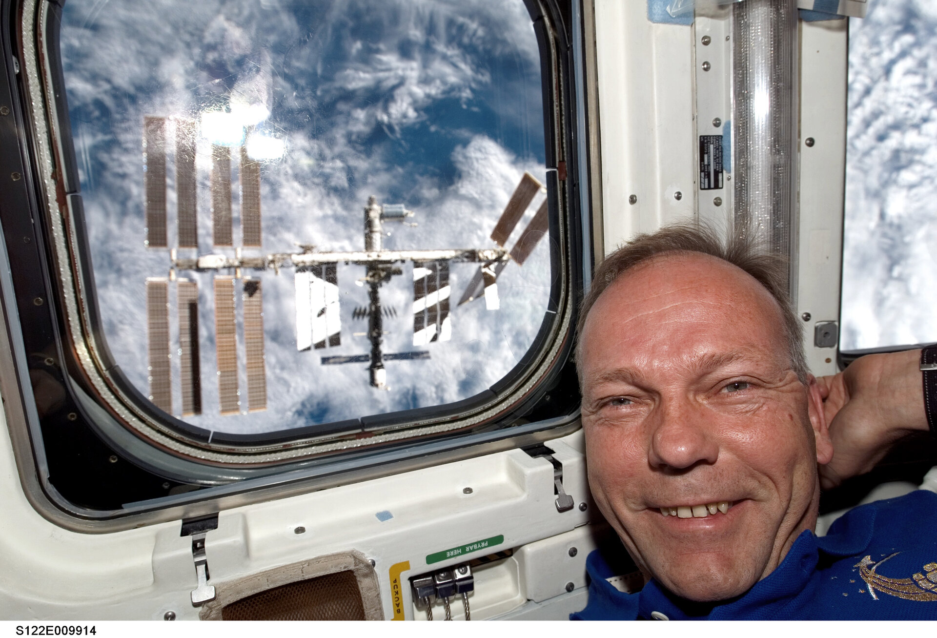 ESA astronaut Hans Schlegel in Shuttle aft flight deck shortly after Atlantis undocked from ISS