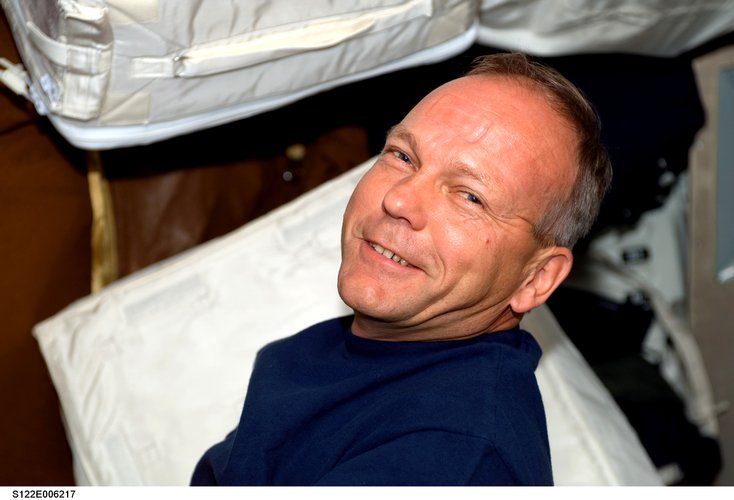 ESA astronaut Hans Schlegel works in Shuttle middeck