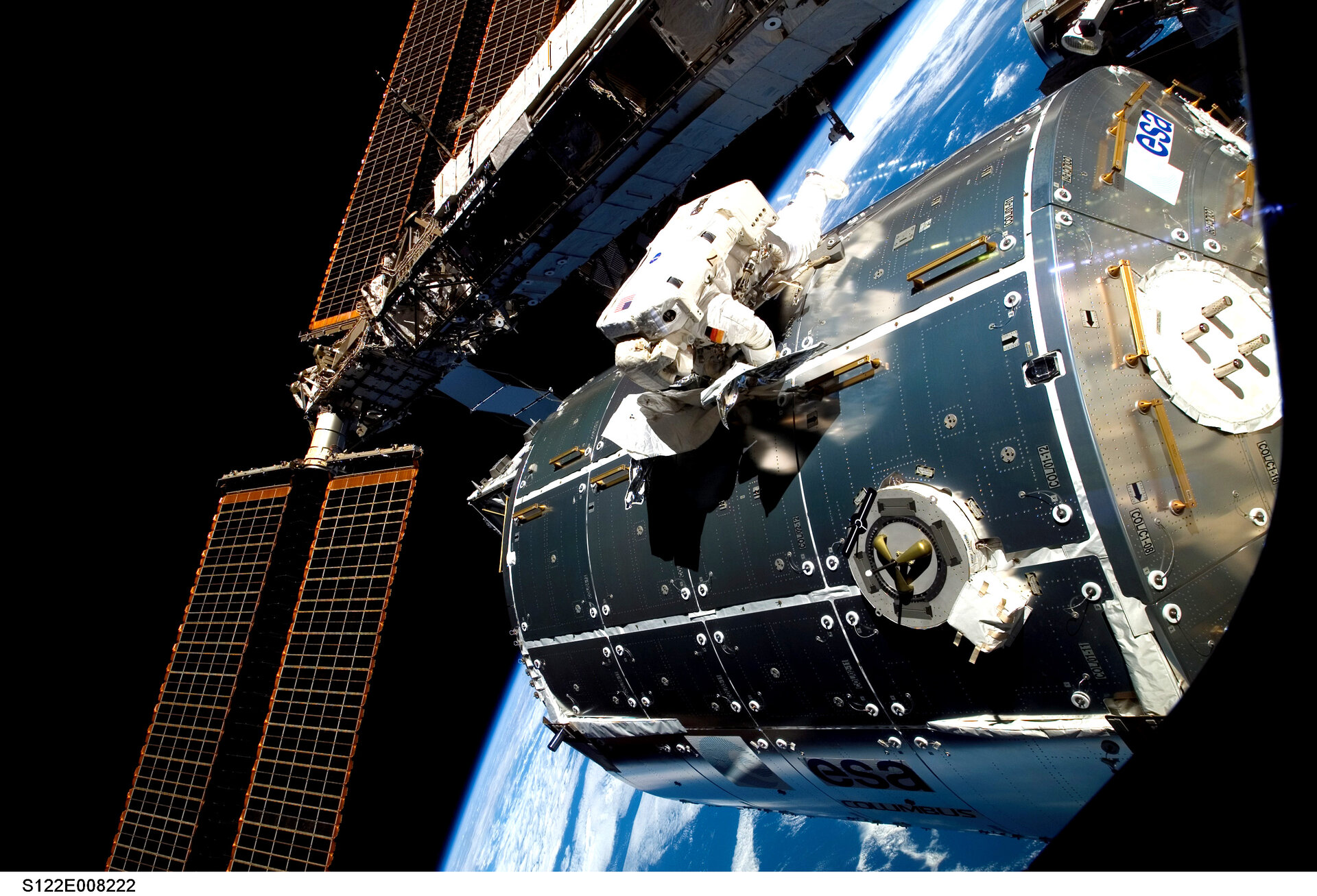 Hans Schlegel works on installing ESA's Columbus module on the ISS