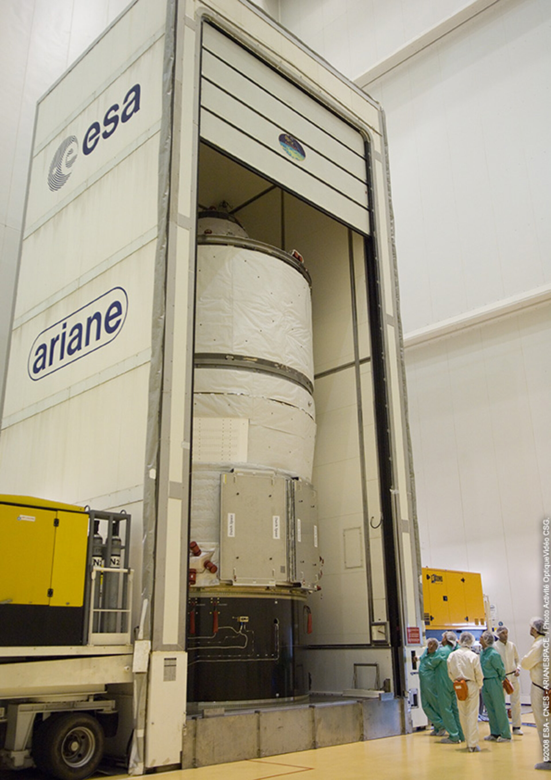 Jules Verne ATV is moved out of container in the Final Assembly Building at Europe's Spaceport in Kourou