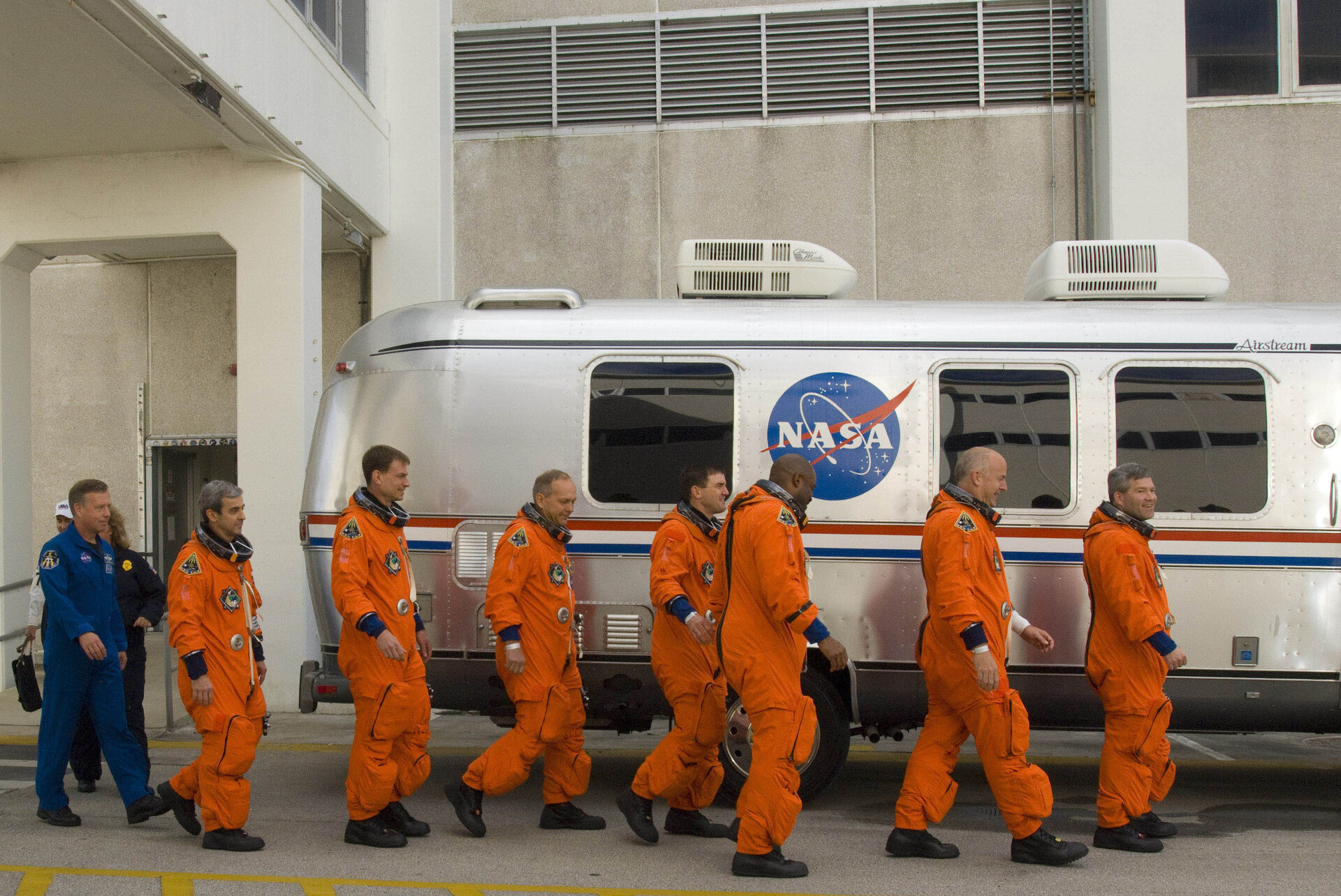 STS-122 mission crew during walk out