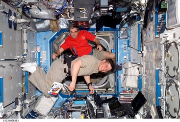 Leopold Eyharts and Bob Behnken at the controls of the ISS robotic arm