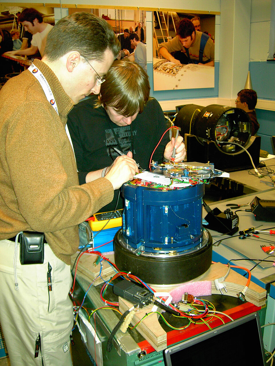 Students test their experiment shortly before it is integrated onto the rocket