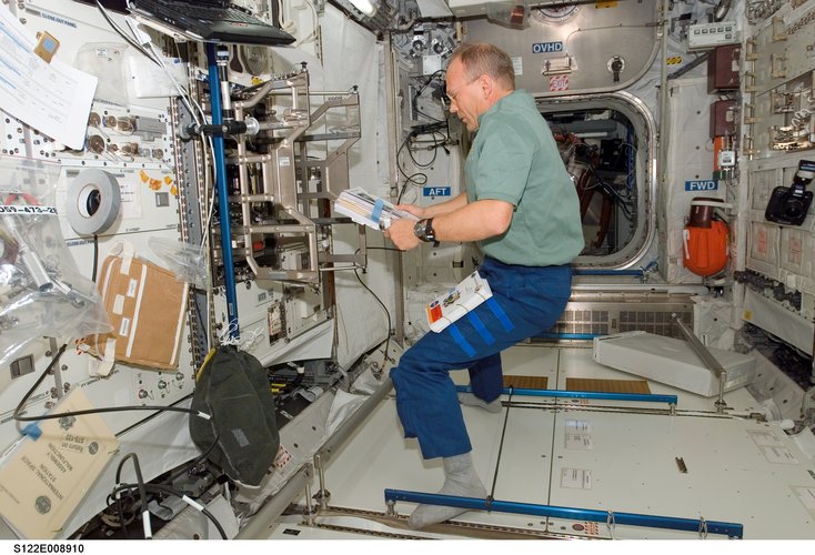 ESA astronaut Hans Schlegel sets up Biolab in Columbus during STS-122 mission