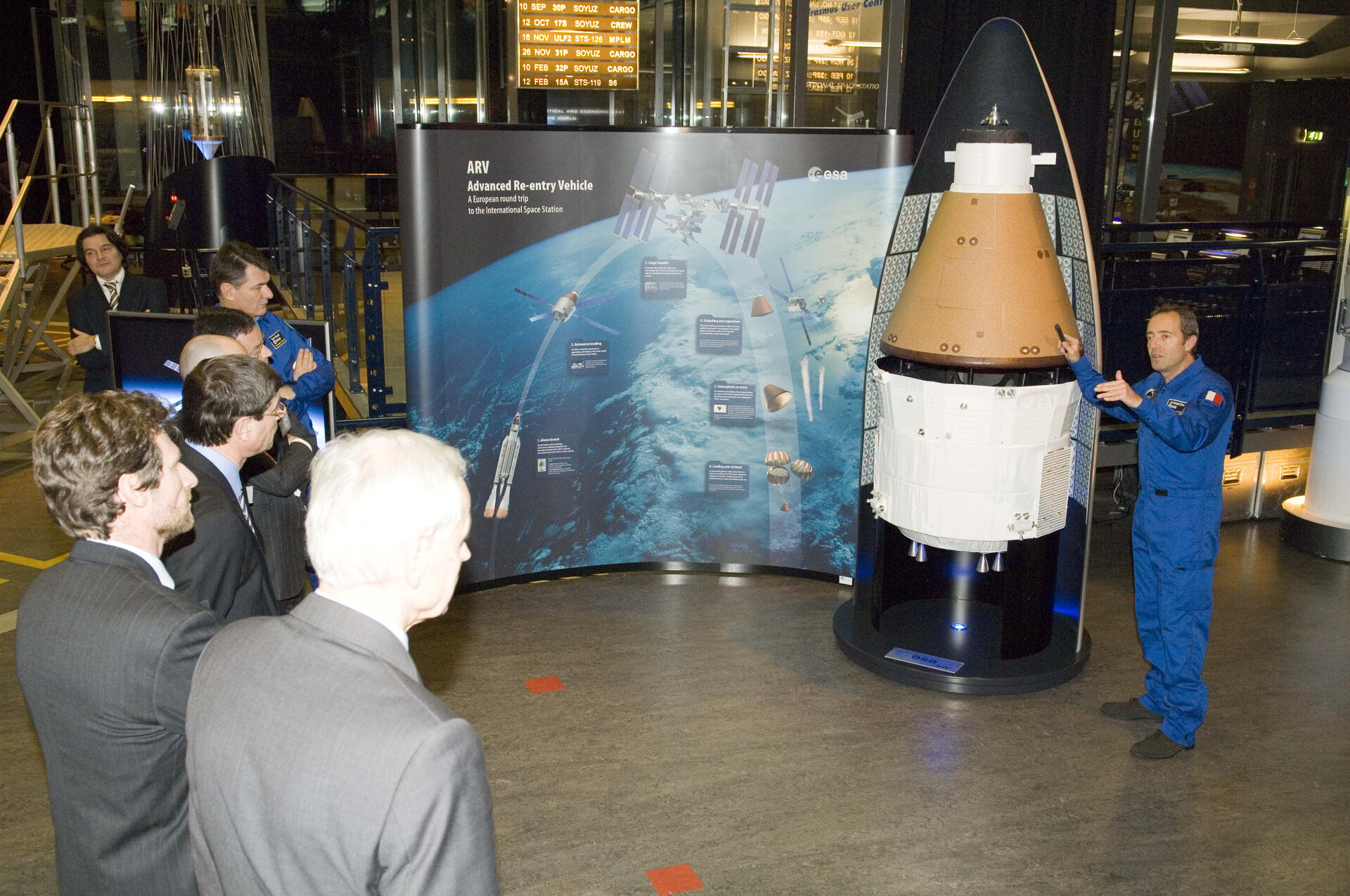 ESA astronaut Jean-Francois Clervoy briefs Ministerial Council delegates on the Advanced Reentry Vehicle concept