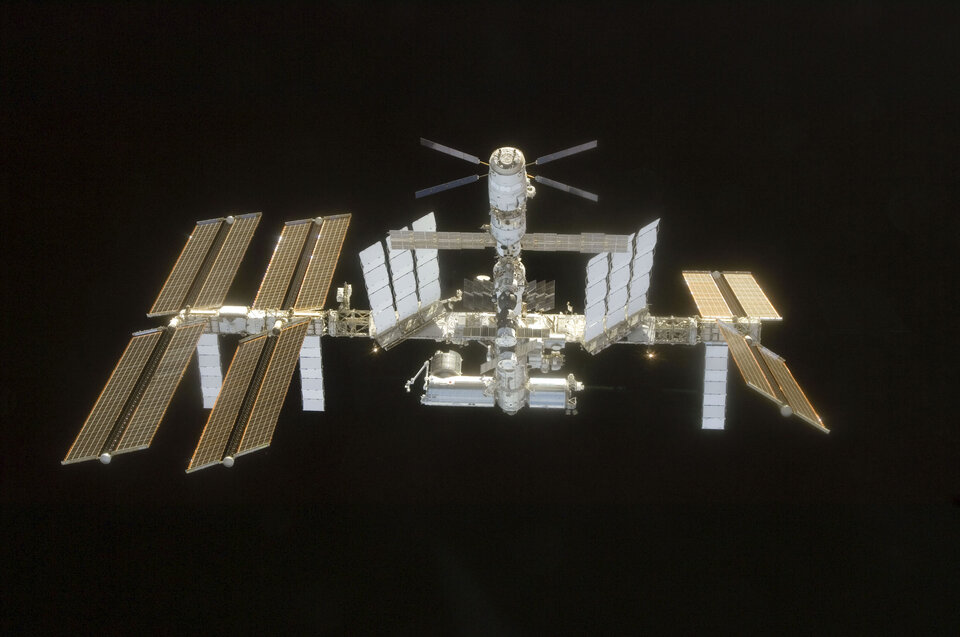 The International Space Station in 2008, with ATV attached top centre