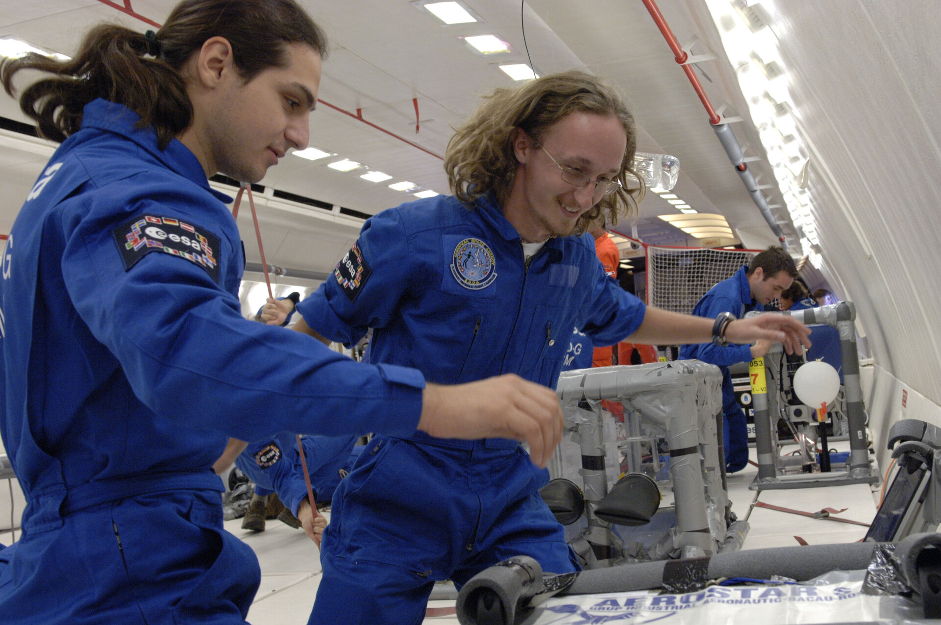 Students performing an experiment in Zero G