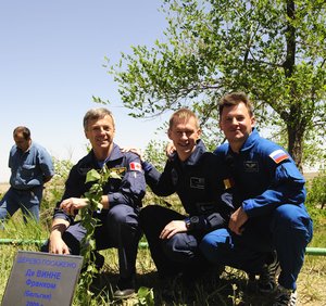 The Soyuz TMA-15 crew take part in the traditional tree-planting ceremony ahead of their launch to the ISS