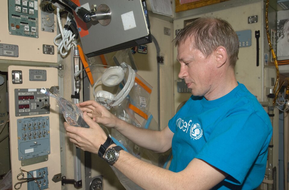 Water is important on Earth and in space: here I am collecting water samples for testing