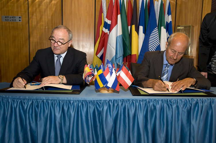 Mr Dordain (left) and Mr Prahm signing the Agreement