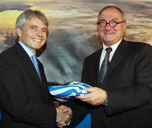 ESA Director General Jean-Jacques Dordain presents ESA flag to Lord Drayson, UK Minister for Science and Innovation