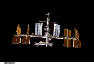 A view of the ISS from Discovery shortly before docking of the STS-128 mission