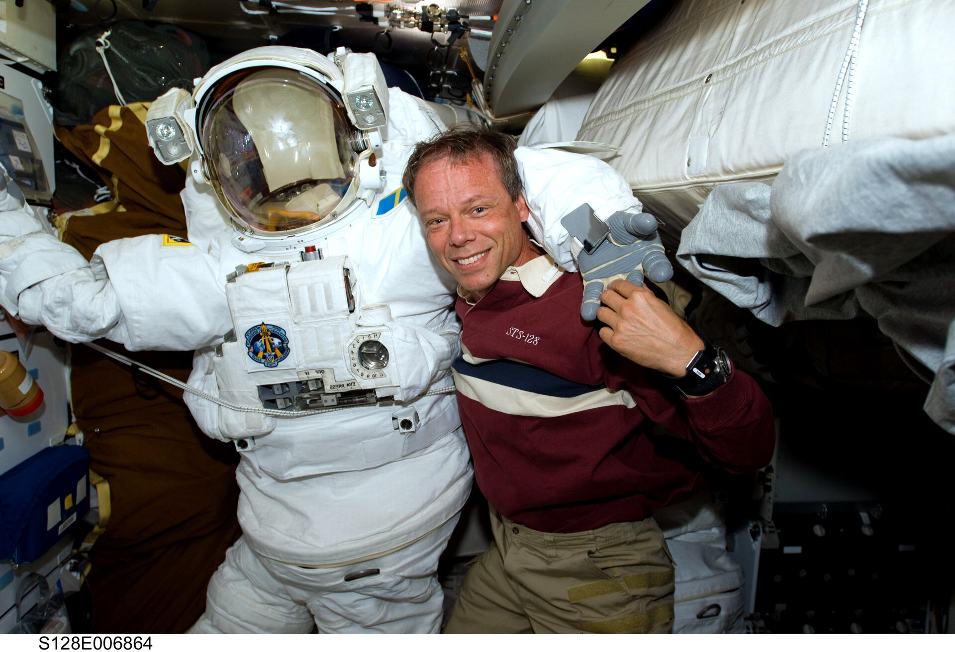 ESA astronaut Christer Fuglesang with EVA spacesuit on Shuttle middeck