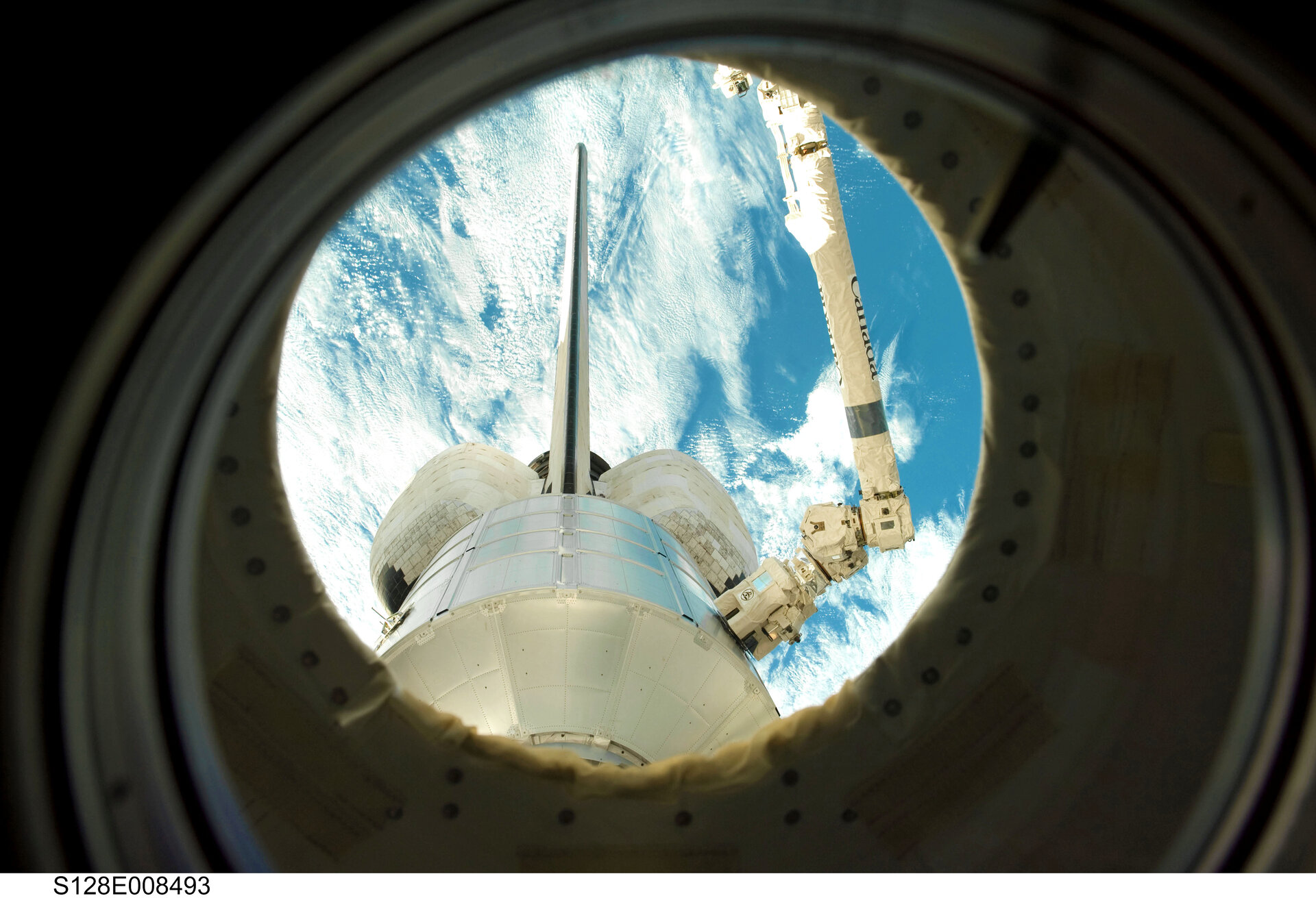 Leonardo MPLM is returned to the Space Shuttle's payload bay for the journey home