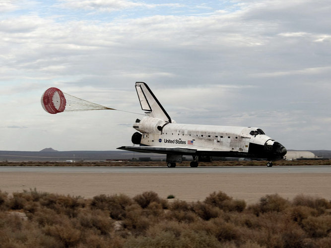 Space Shuttle Discovery slows to a stop after landing at Edwards Air Force Base at the end of the STS-128 mission