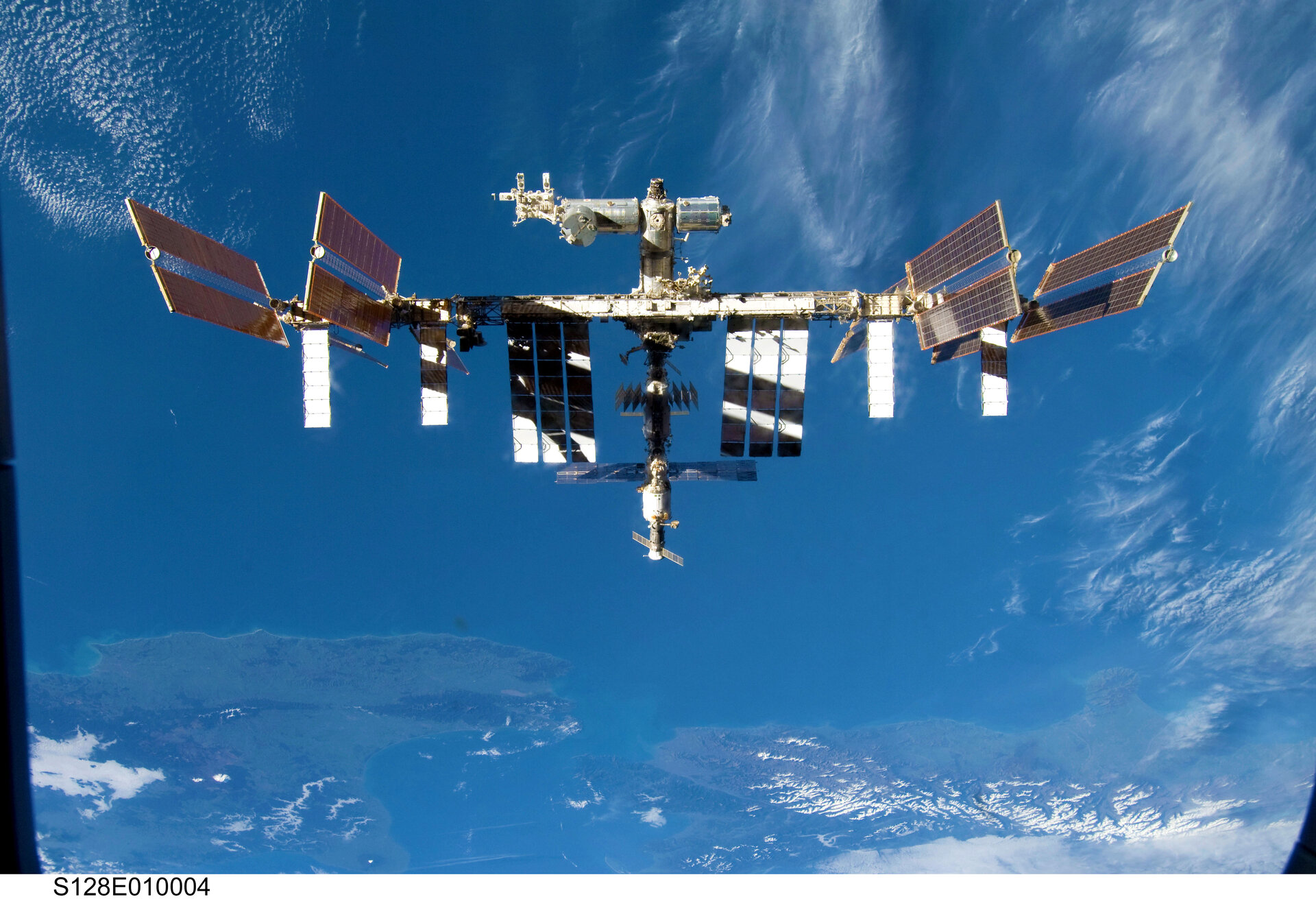 The International Space Station is seen from Space Shuttle Discovery as the two spacecraft begin separation