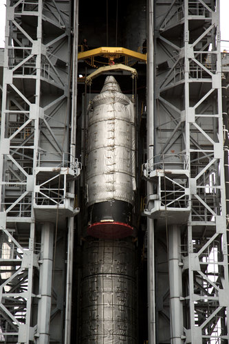 Upper composite is hoisted to the top of the tower