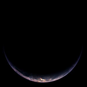 Illuminated crescent of Earth showing part of South America and Antarctica