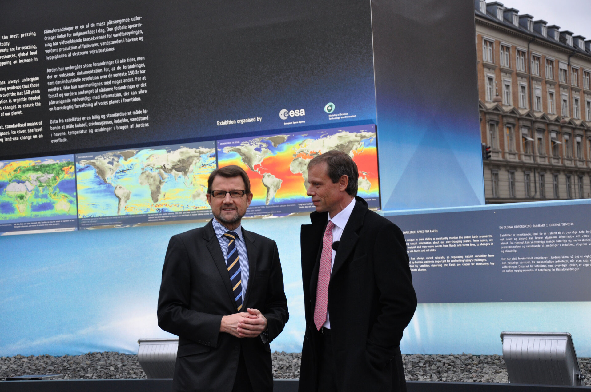 H. Sander (left) and ESA astronaut C. Fuglesang in front of the exhibit