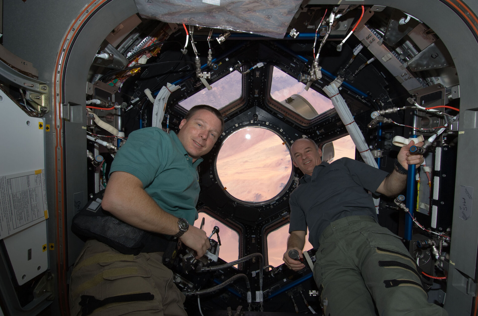 Astronauts Terry Virts and Jeffrey Williams in the Cupola