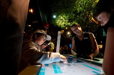 Visitors using Earth Observation interactive screens