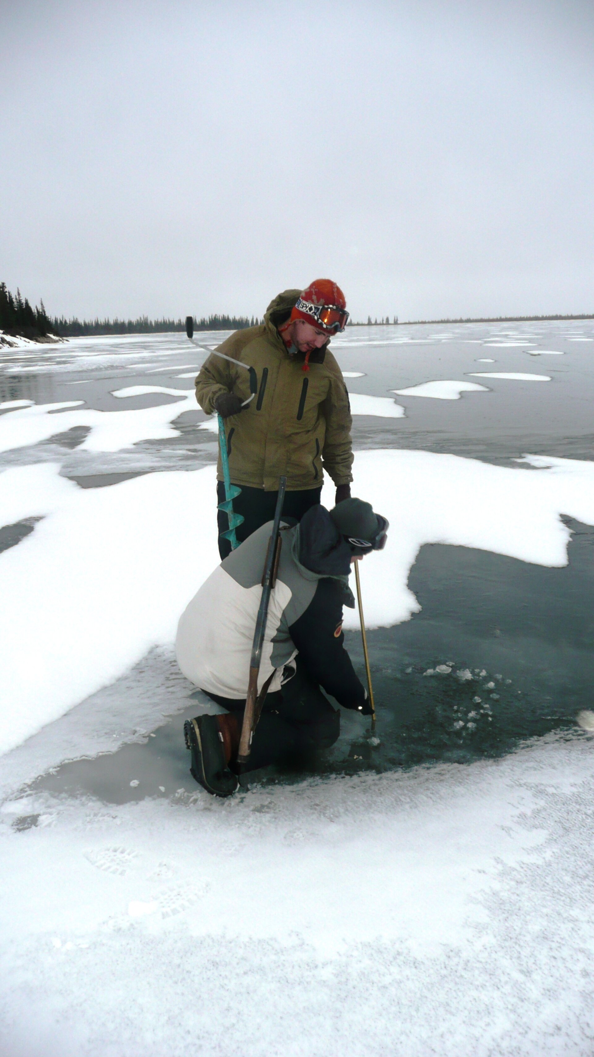 Taking lake ice measurements