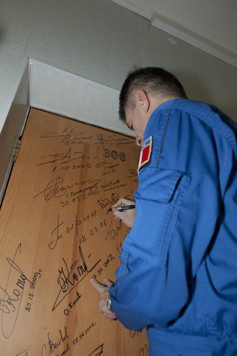 A launch day ritual: signing the door