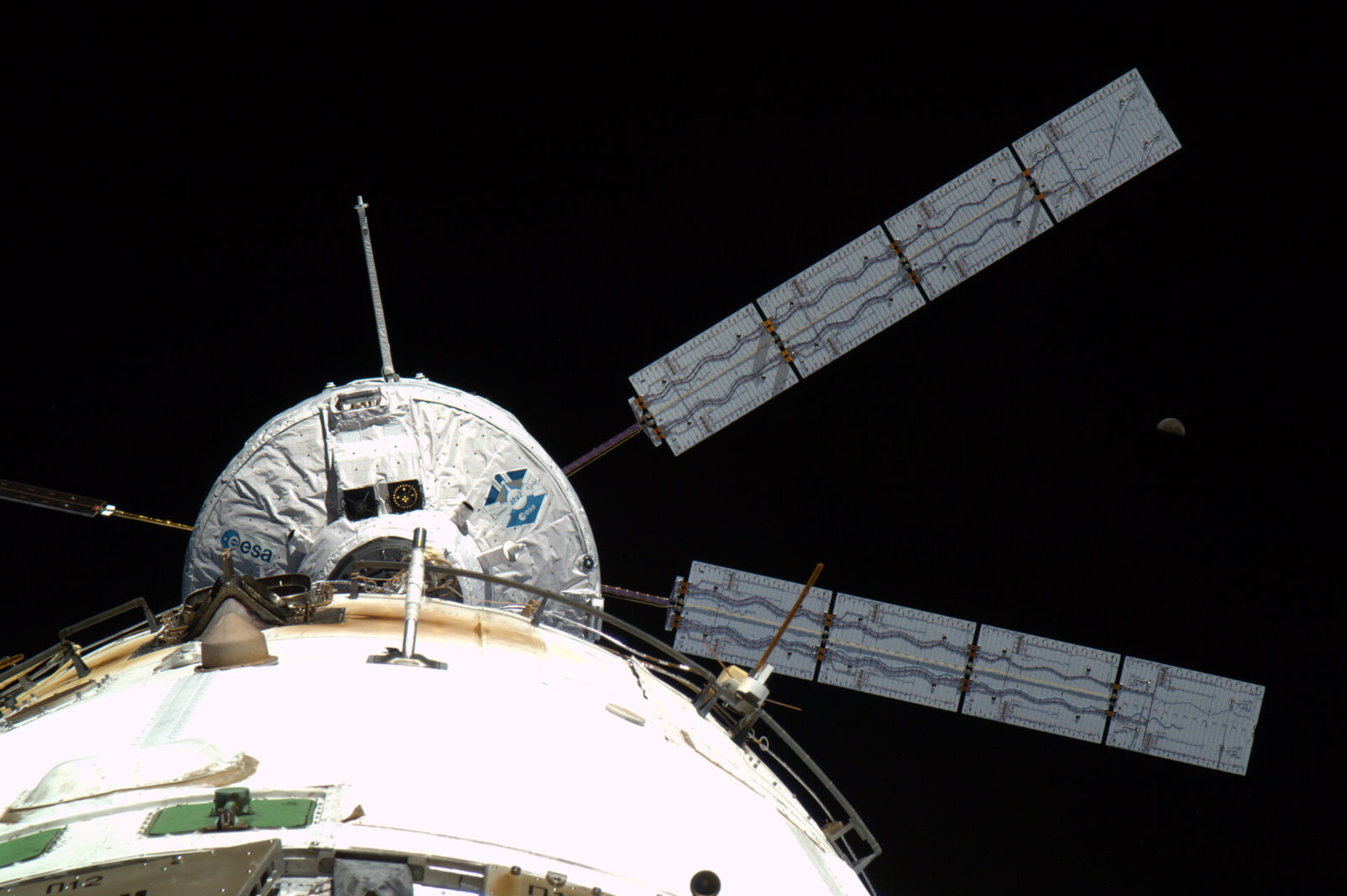 ATV docking to ISS under the watchful eye of the Moon