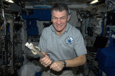 Paolo Nespoli with a can crusher
