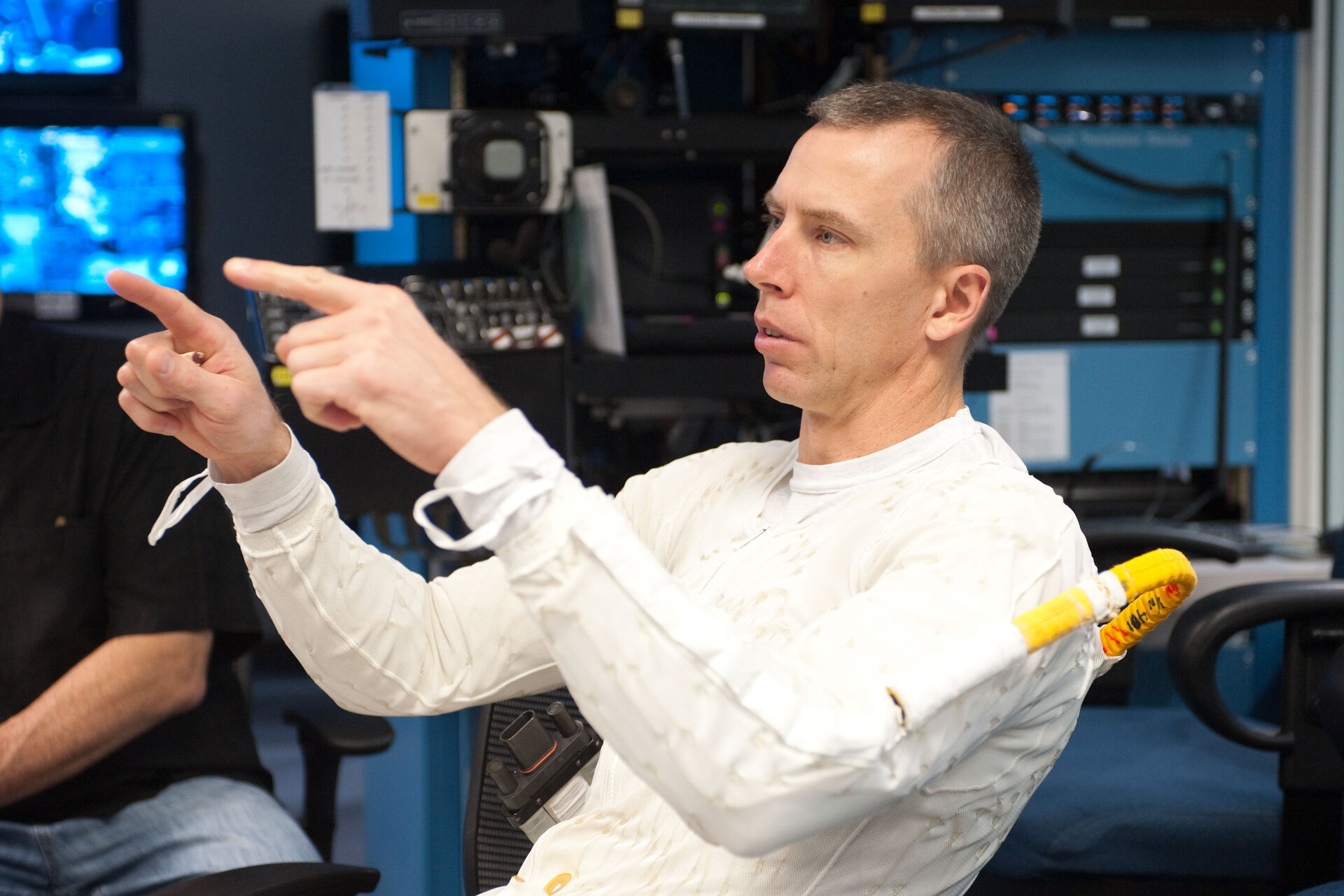 Andrew Feustel wearing a liquid cooling and ventilation garment