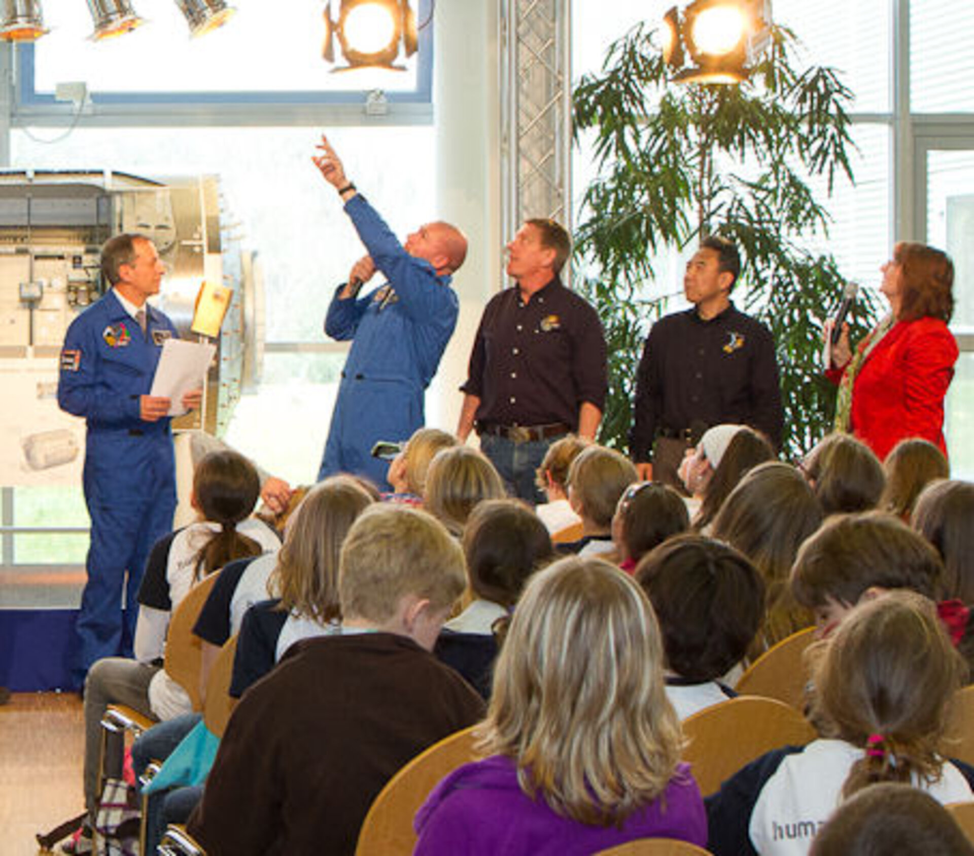 Four astronauts entertaining Mission X children