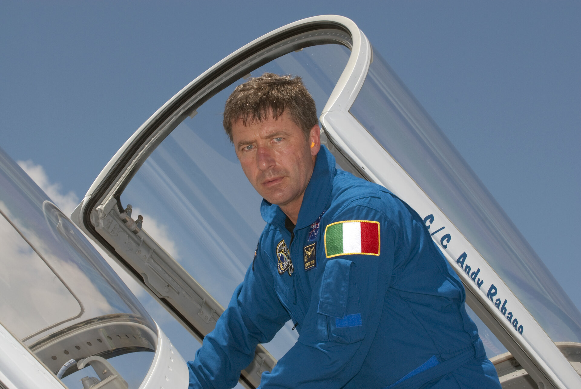 Roberto Vittori climbs out of a T-38 jet