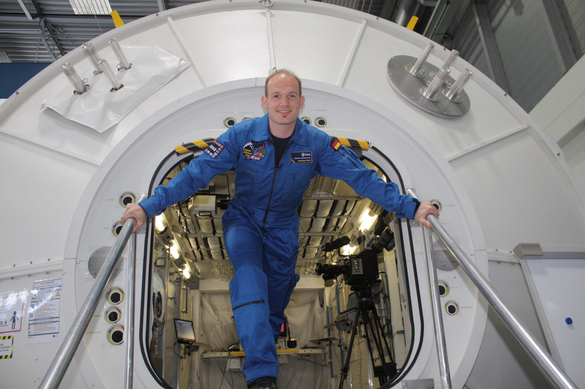 Alexander Gerst coming out from a Columbus laboratory mockup