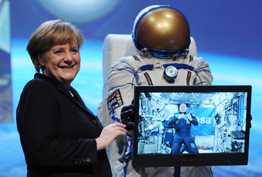 Chancellor Angela Merkel talking to André Kuipers at CeBIT 2012.