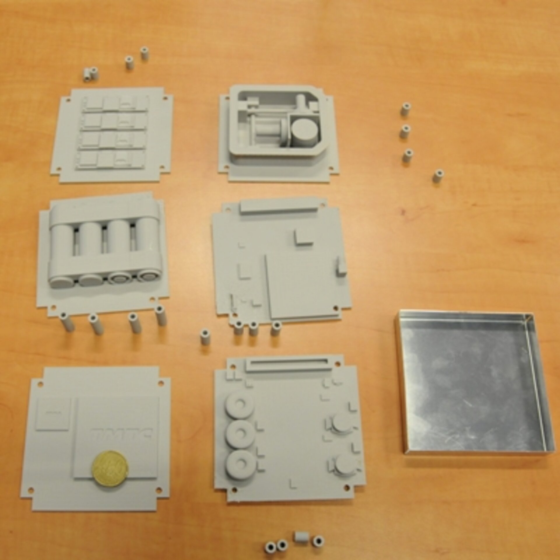 Model components laid out with fifty Euro cent coin to show relative size