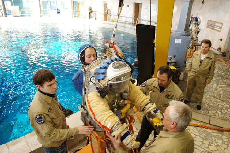 Thomas Pesquet getting into Orlan suit