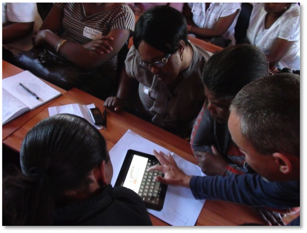 Teachers learning to use tablet computer