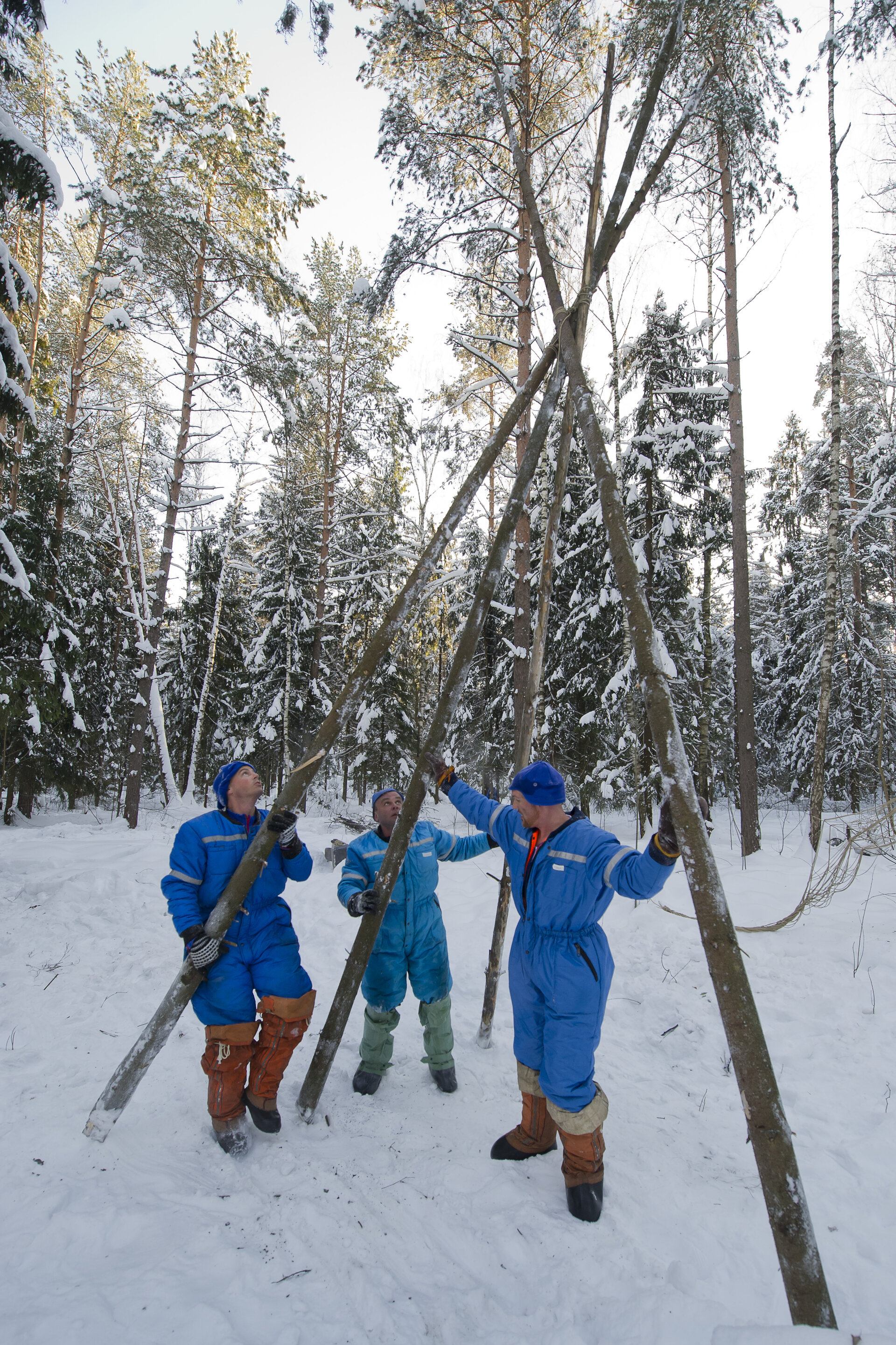 Building a shelter during winter survival training