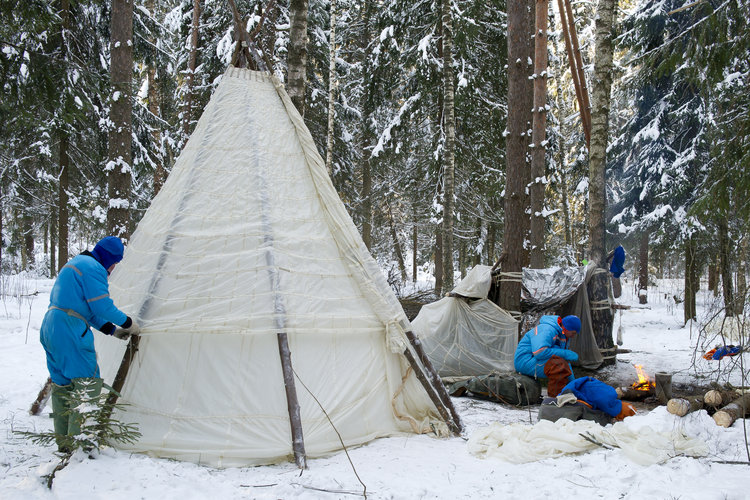 Building a shelter during winter survival training