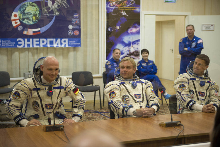 Expedition 40/41 crew members dressed in their Russian Sokol suits 