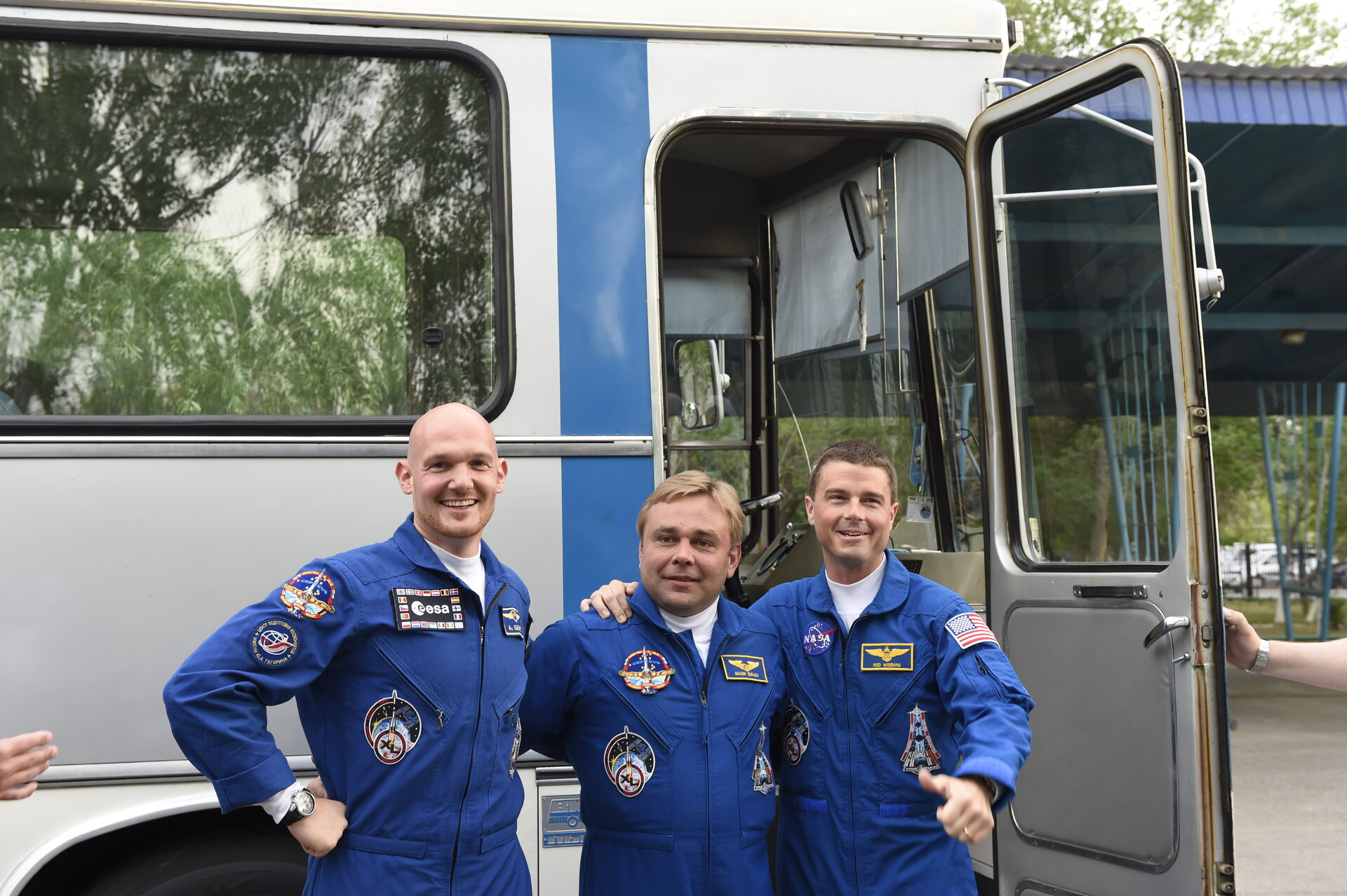 Expedition 40/41 crew members shortly after leaving the Cosmonaut Hotel