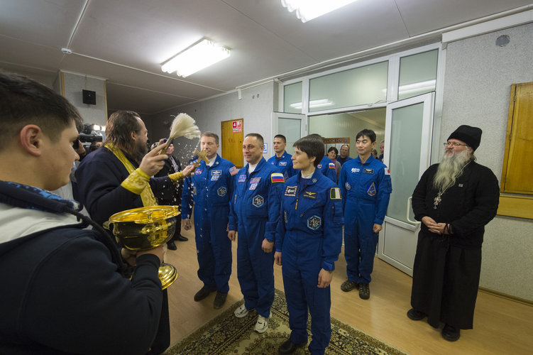 Expedition 42/43 crew members receive the traditional blessing