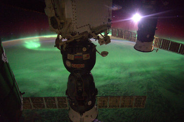 Moon diving into a glowing ocean of green