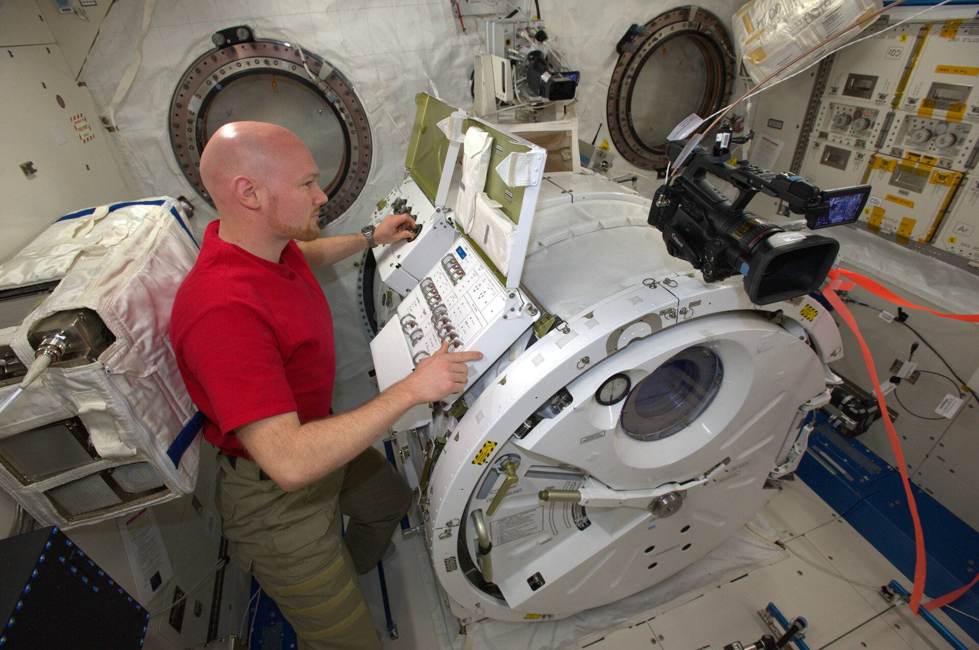 Alexander Gerst launching CubeSats from Space Station